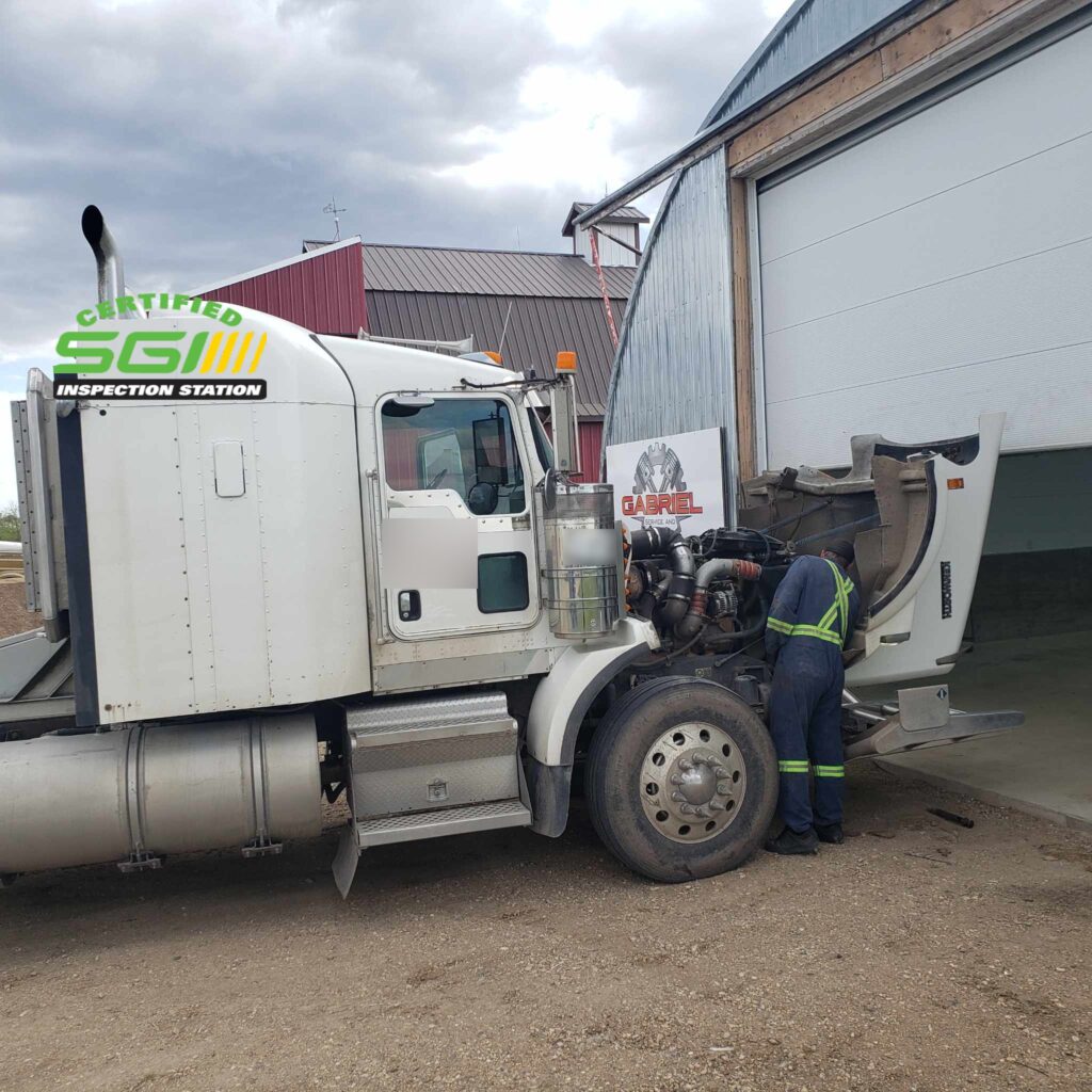 A mechanic repairing at a certified sgi inspection station.